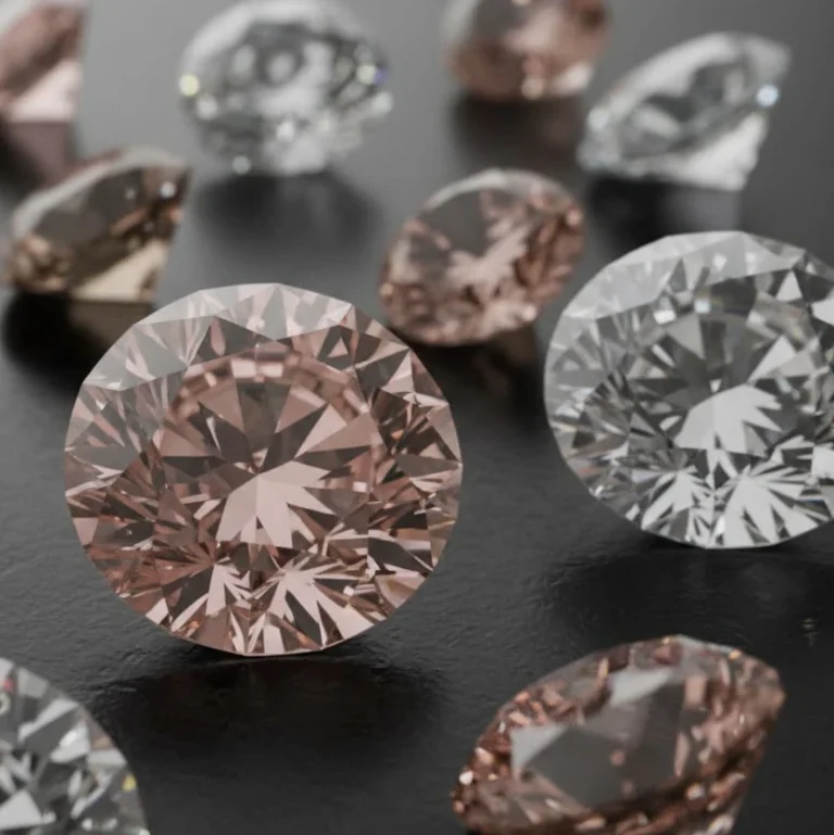 Assortment of sparkling, cut diamonds including pink and clear stones, representing AMML's investment and trade in Africa's precious diamond industry.