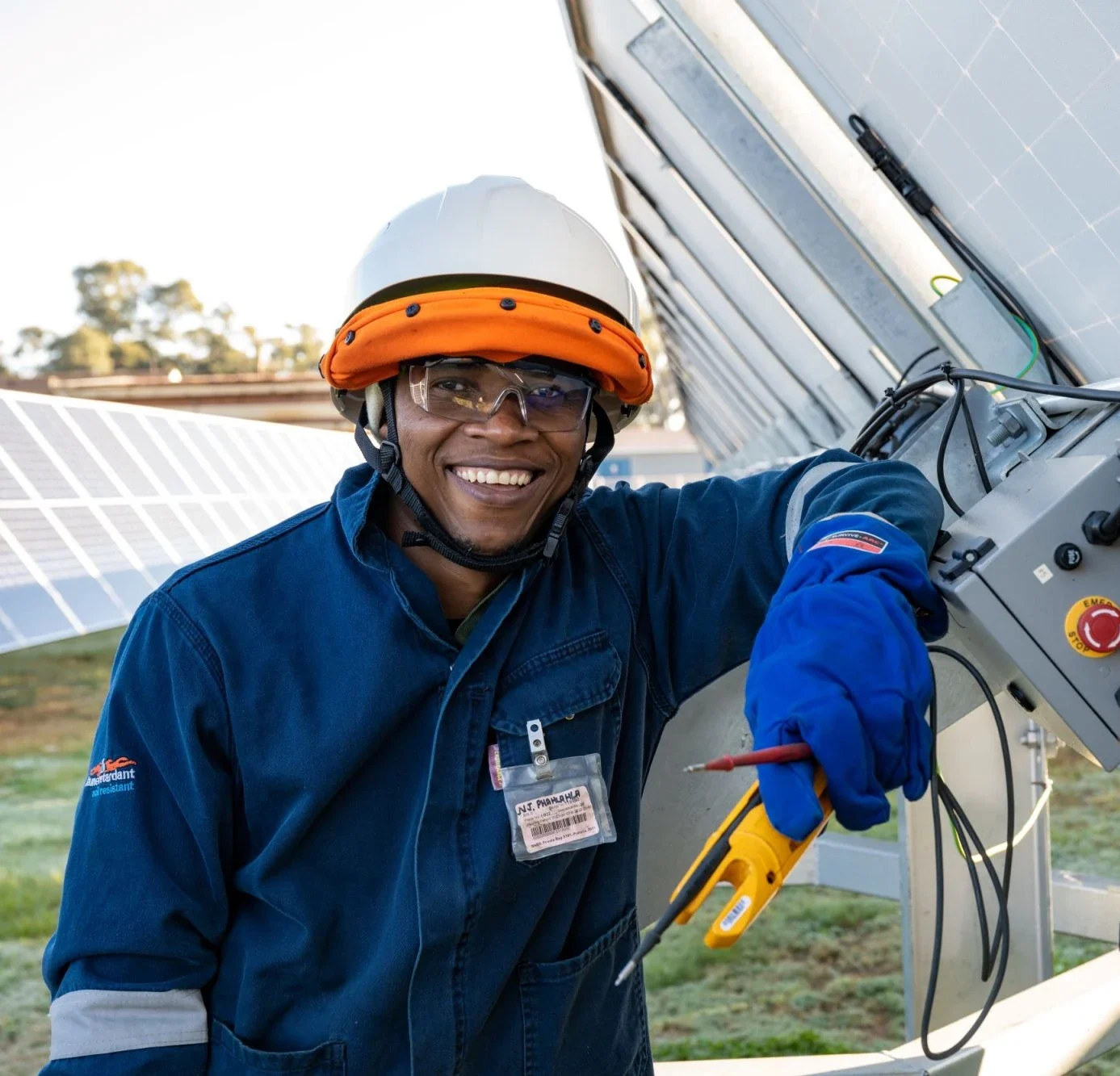AMML project manager and West African community leaders collaborating on-site, discussing investment and sustainable development projects.