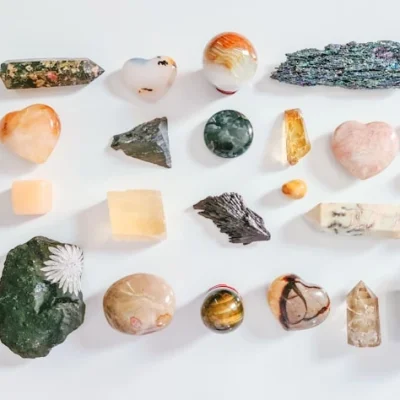 A variety of African rough and polished gemstones in different colors and shapes, representing AMML's investment in high-value premium mineral resources.